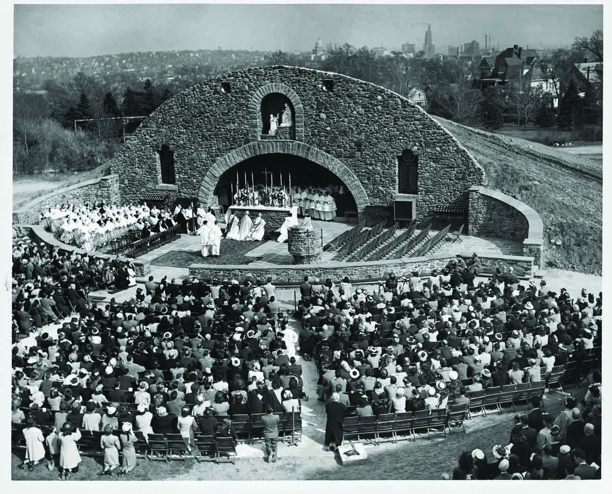 An outdoor Mass at the dedication of the War Memorial Grotto.