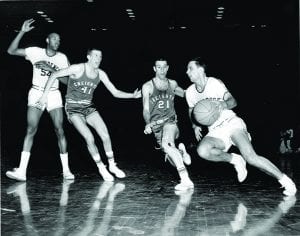 Jim Hadnot ’62 jockeys for position in a home game against Creighton University during the 1960-61 season.