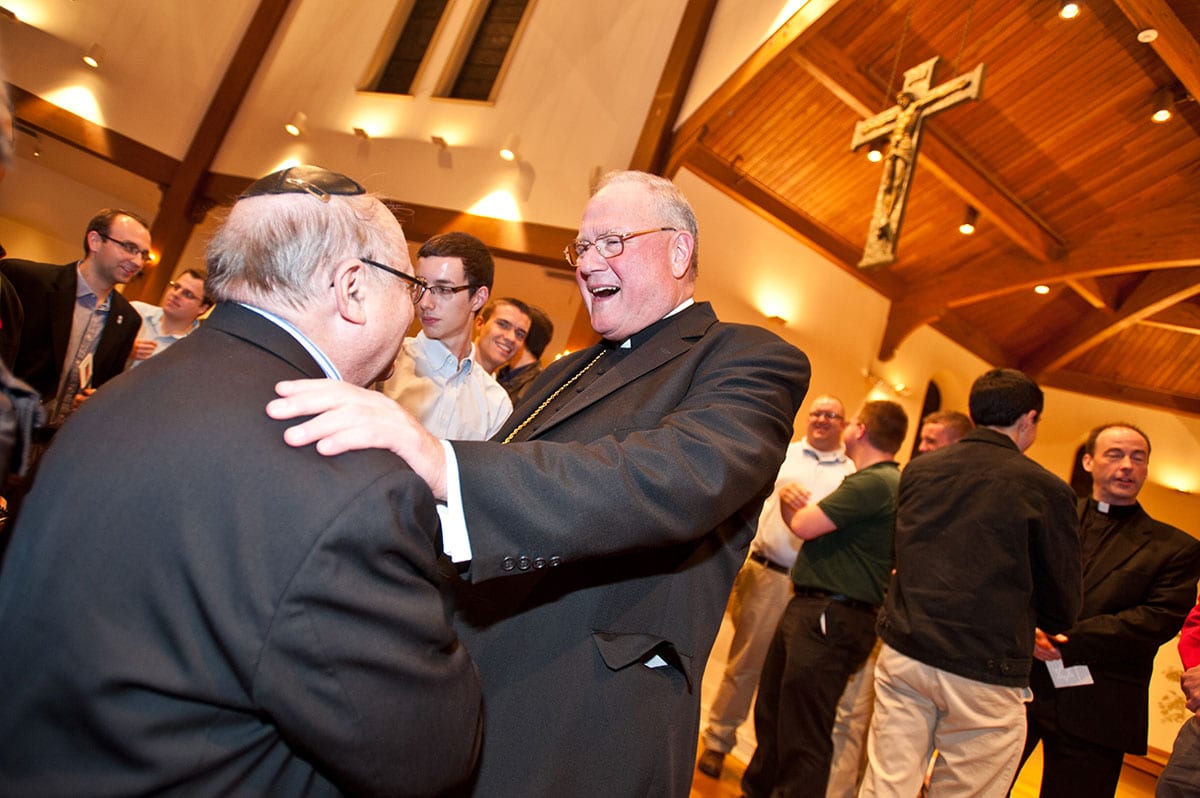 Timothy Cardinal Dolan greets a member of the Jewish community after his presentation in St. Dominic Chapel.