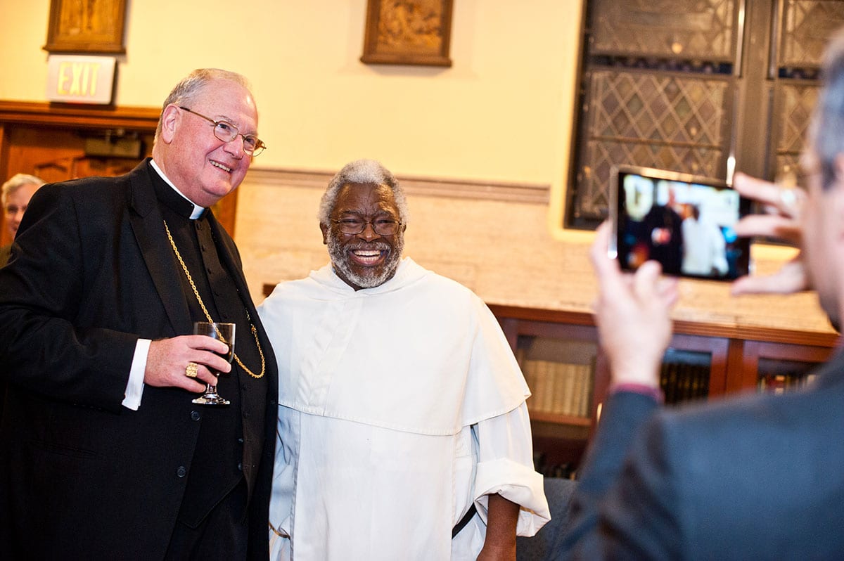 Cardinal Dolan poses with Rev. Peter M. Batts, O.P., assistant professor of theology, during a reception in the Center for Catholic and Dominican Studies.