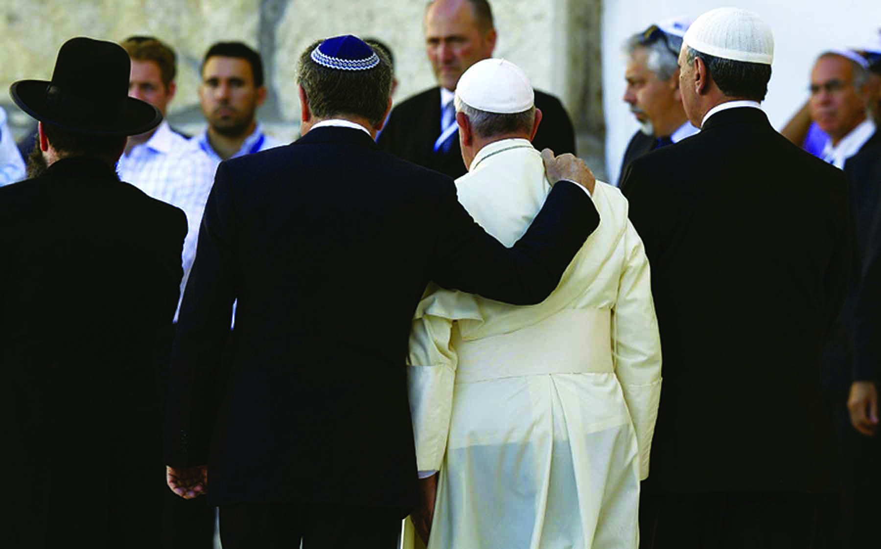 Argentine Rabbi Abraham Skorka, a longtime friend, embraces Pope Francis after praying at the Western Wall in Jerusalem in 2014. (Photo by CNS/Paul Haring)