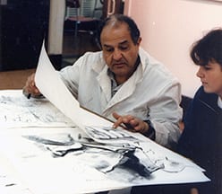 Rev. Adrian G. Dabash, O.P. '62 & '63G works with a student in 1987.