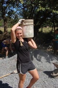 Kelsey Laursen ’16 (Wallingford, Conn.) carries concrete during a winter break trip to El Manzano, Nicaragua, as part of the Community Literacy course. The students helped build a high school library for community residents. 