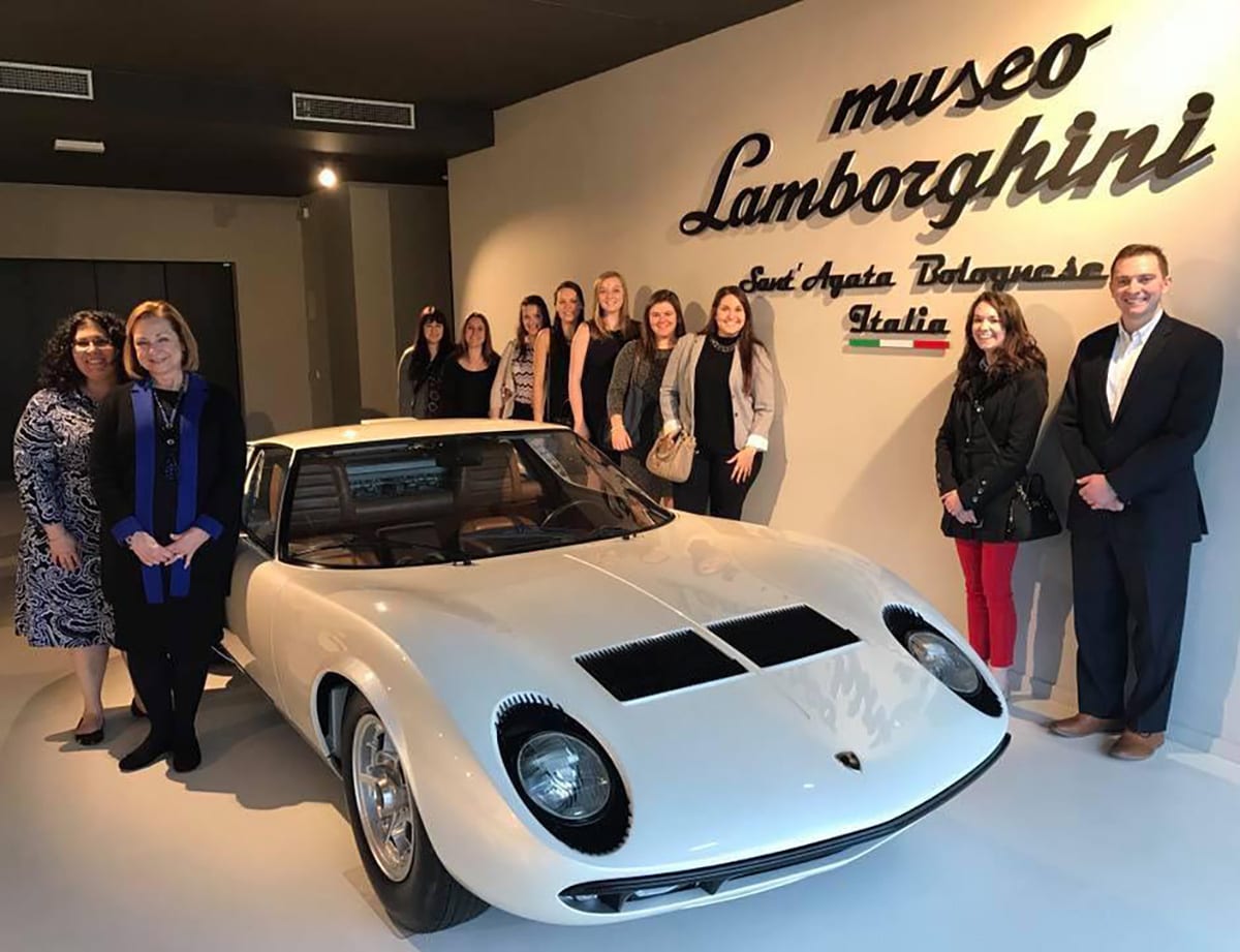 At left, from left, Dr. Jacqueline Elcik and Dr. Helen Caldwell tour the Lamborghini Museum with the MBA students. 