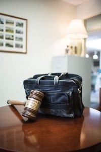Brum's worn briefcase and a gavel that was given to him as a memento.
