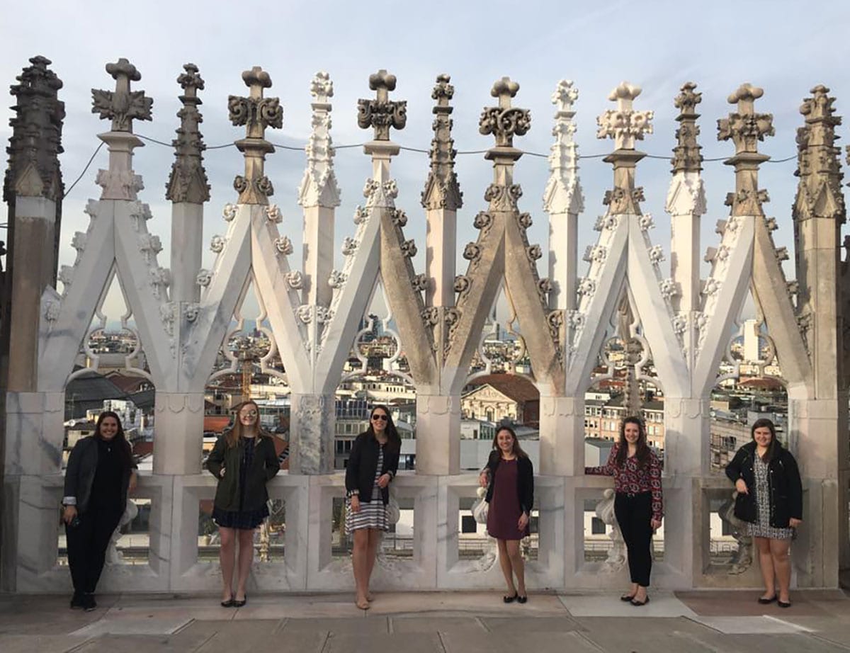 The MBA students enjoy the view after taking the 250 steps to the top of the Duomo, an Italian cathedral church, in Milan. From left are Nikki Gyftopoulos, Rose Mackey ’16, Alexis Egidio ’16, Alanna Fursich ’15, Ava Landry ’16, and Jaimie 