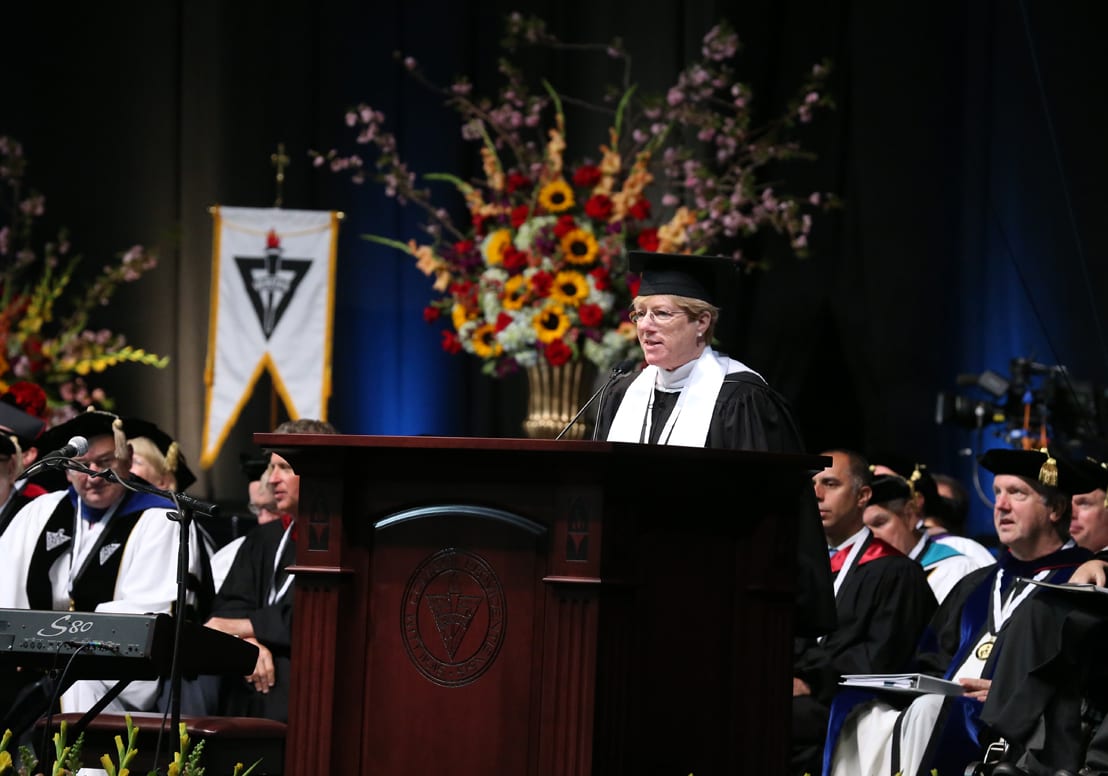 Mary Pat Caputo '79 welcomes graduates into the National Alumni Association.