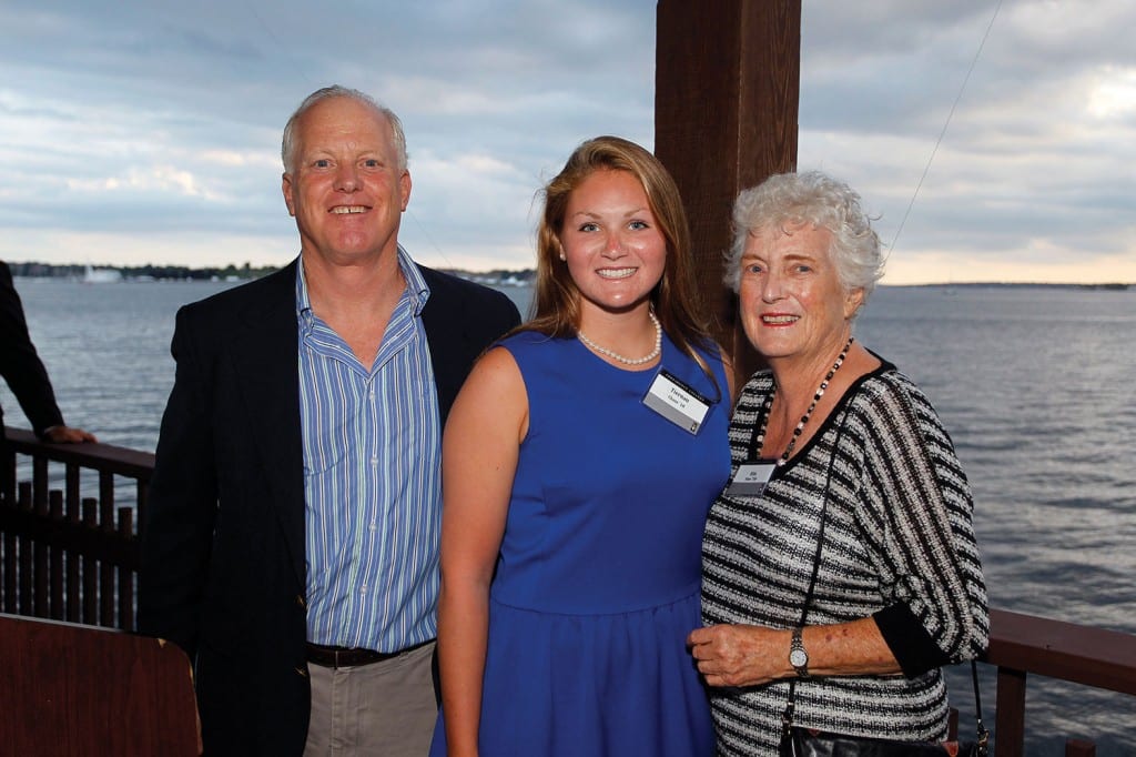 Attendees at the summer reception in Newport included, from left, Peter Slom ’78, Tiernan Chase ’18, and Rita Slom. Chase received the Newport County Alumni Club’s Aaron J. Slom ’42 Memorial Scholarship. Peter and Rita are the son and wife of Mr. Slom.