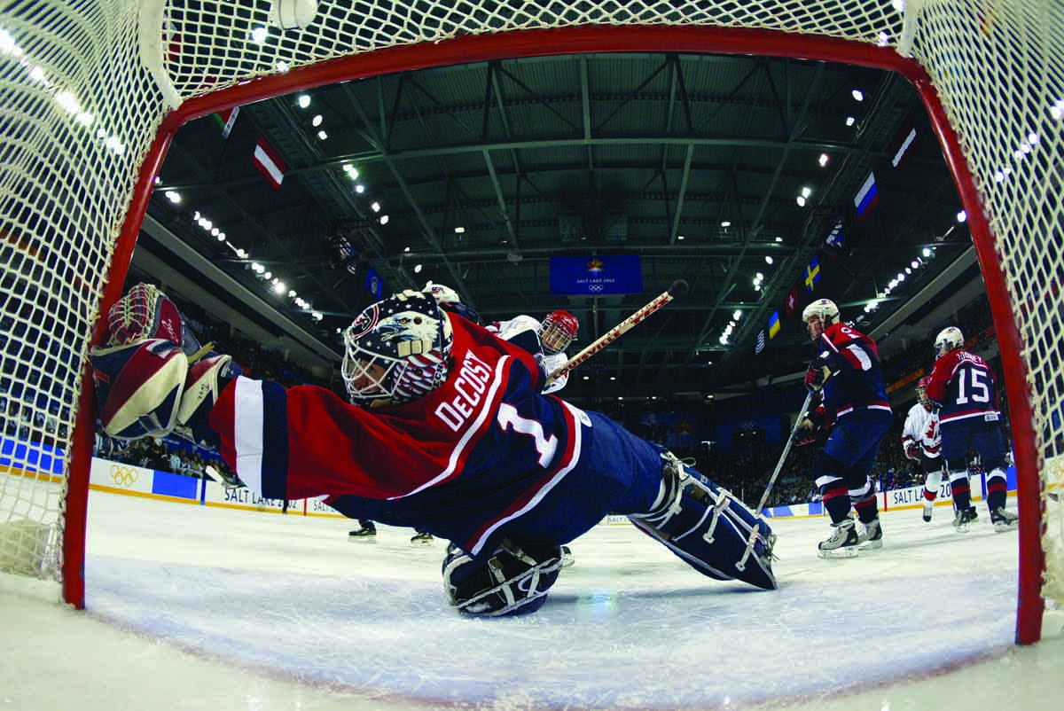 DeCosta-Hayes '00 stretches to make a save in the 2002 Olympics' gold-medal game against Canada.