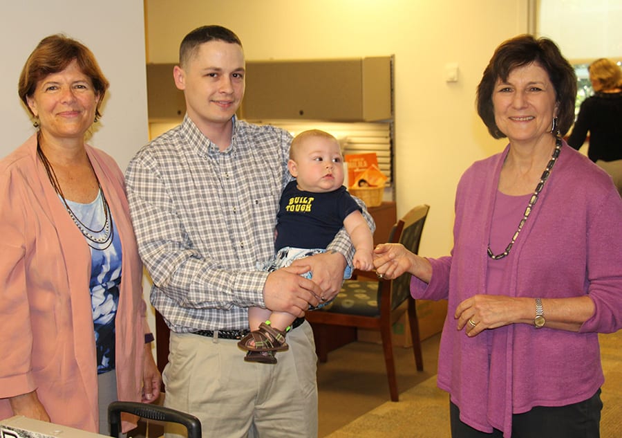Sean Moore '17SCE visits the SCE office with his son, Decklin. With him are Anne Nagle, SCE assistant dean, left, and Dr. Janet Castleman, SCE dean. 