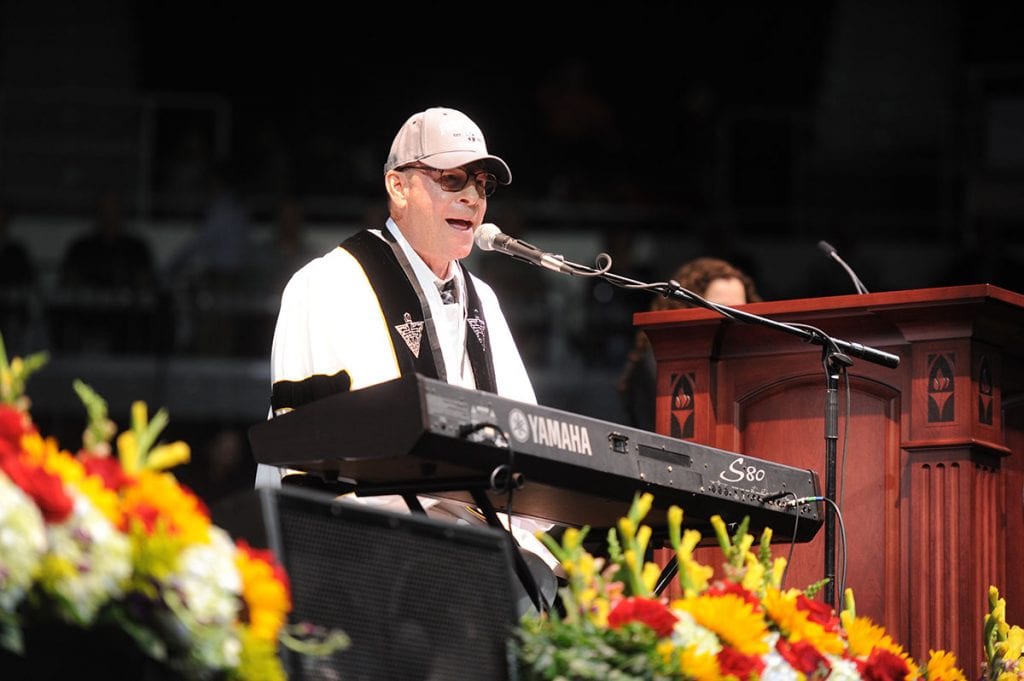 Clark had the audience singing and clapping during his Commencement Address. 