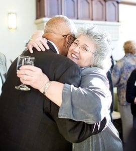 Walker is hugged by Hon. Maureen McKenna Goldberg ’73, a Rhode Island Supreme Court justice. 