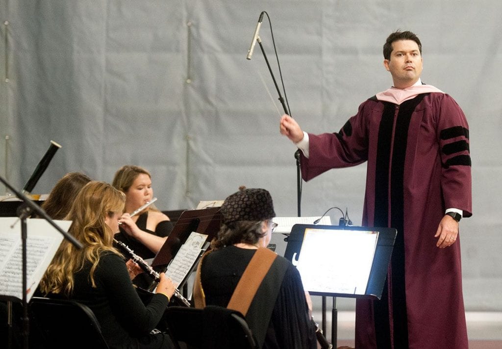 Dr. Eric C. Melley, a new full-time faculty member in music, directs the PC Symphonic Winds ensemble.