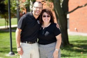 Derek Alfama, assistant women’s ice hockey coach, greets Karen Monti Flynn ’80 & ’15P on move-in day. 