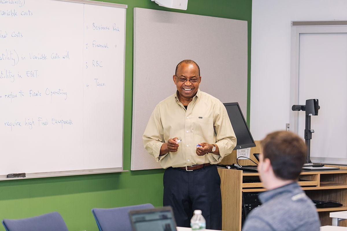 Dr. Vivian Okere leads an undergraduate finance class in the Arthur F. and Patricia Ryan Center for Business Studies.
