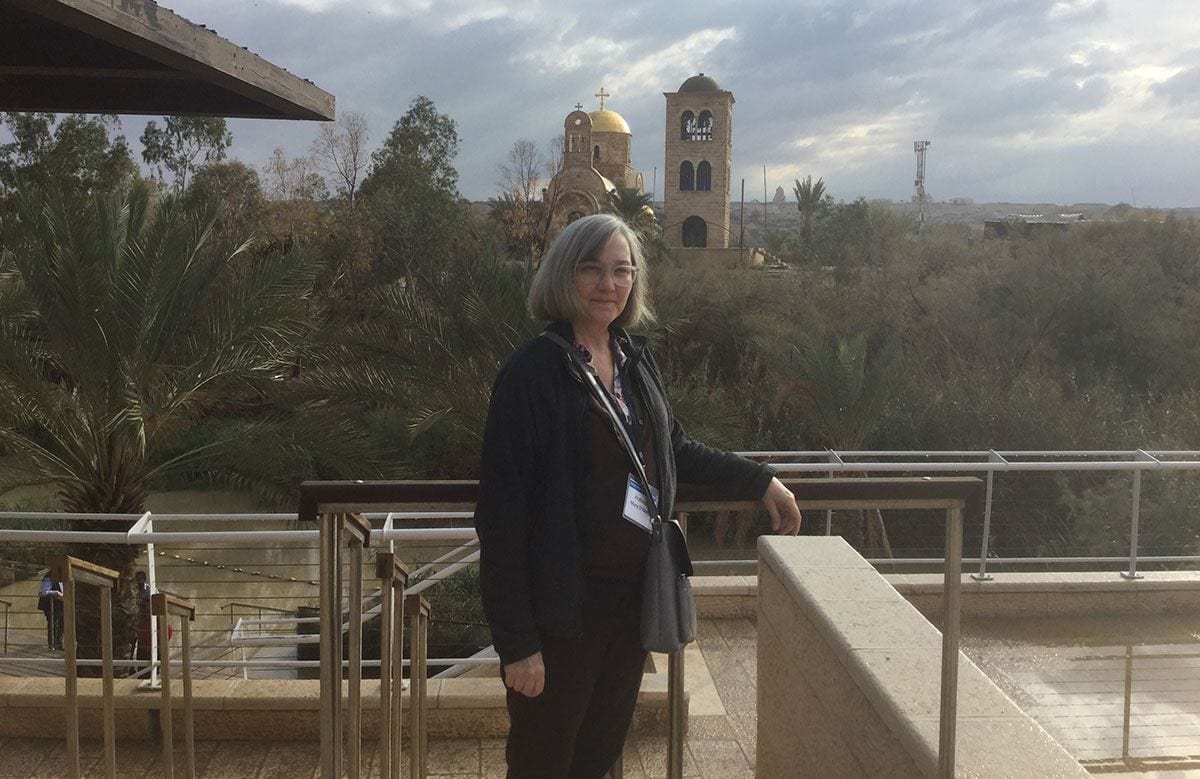 Dr. Mary O’Keeffe stands alongside the Jordan River, rear, during her fellowship trip to Israel. The river is believed to be where Jesus was baptized. 