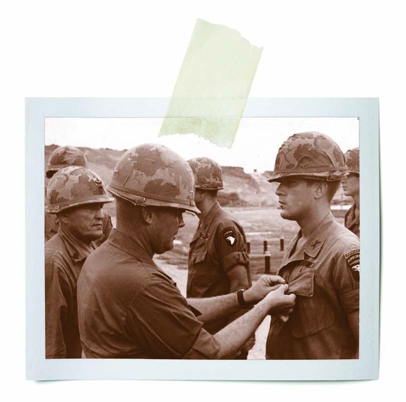 Capt. Gerald F. Dillon '68 & '74G, right, receives his second Silver Star and the Purple Heart at an awards ceremony at Camp Eagle, Vietnam, in 1970.
