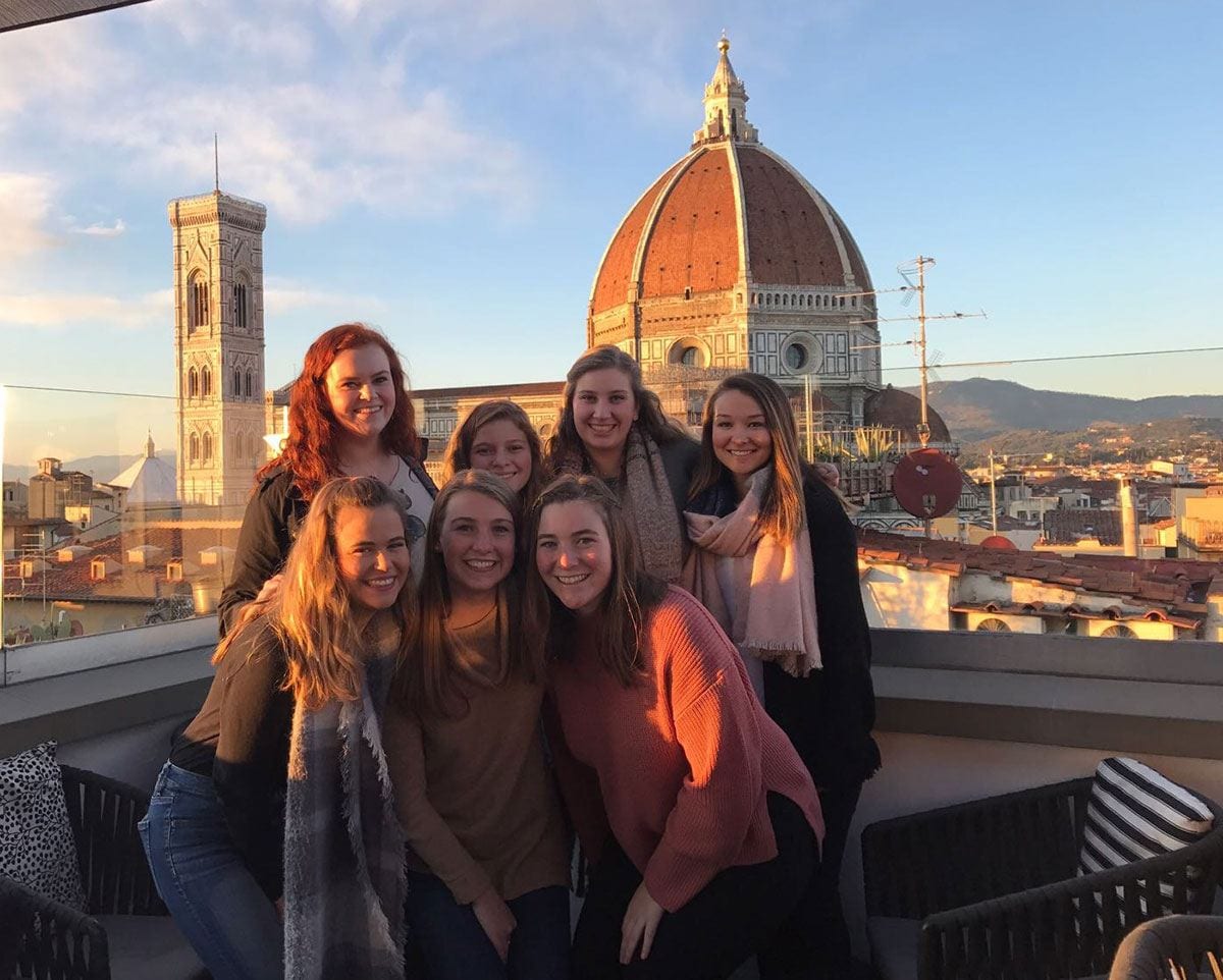 PC student teachers gather on a hotel rooftop to take in a 360-degree view of Florence on one of their last nights there during the Fall 2017 semester. They are, front row. from left: Gabrielle Farino ’19, Lauren Barrett ’19, and Anne Vernon ’19. Second row: Molly Powers ’19, Ysabelle Errico ’19, Lauren Minerva ’19, and Julia Miller ’19. Behind them is the Cathedral of Santa Maria del Fiore. 
