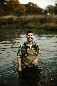 Dr. Jonathan L. Richardson, assistant professor of biology, in the water in Warren.