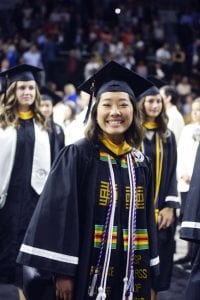 Olivia Lo is all smiles as she processes into the arena with classmates.