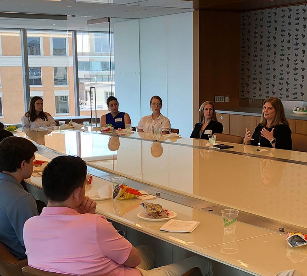 Beth A. Viola ’90, senior policy advisor with Holland & Knight, a strategic communications agency, right, hosts a luncheon meeting with leadership fellows.