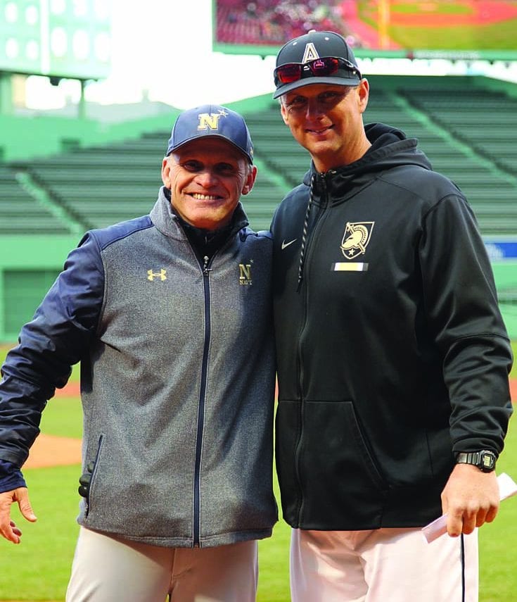 Paul Kostacopoulos '87, left, and Jim Foster '93 unite at Fenway Park. (Mady Salvani photo)