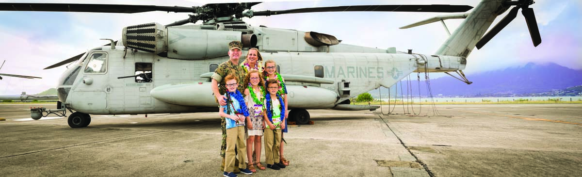 The Hunter family in Hawaii, in front of the CH-53 Super Stallion. With Kevin and his wife, Jennifer, are their children, Victoria, 12; Samantha, 10; and Sean and Alexander, both 10. 