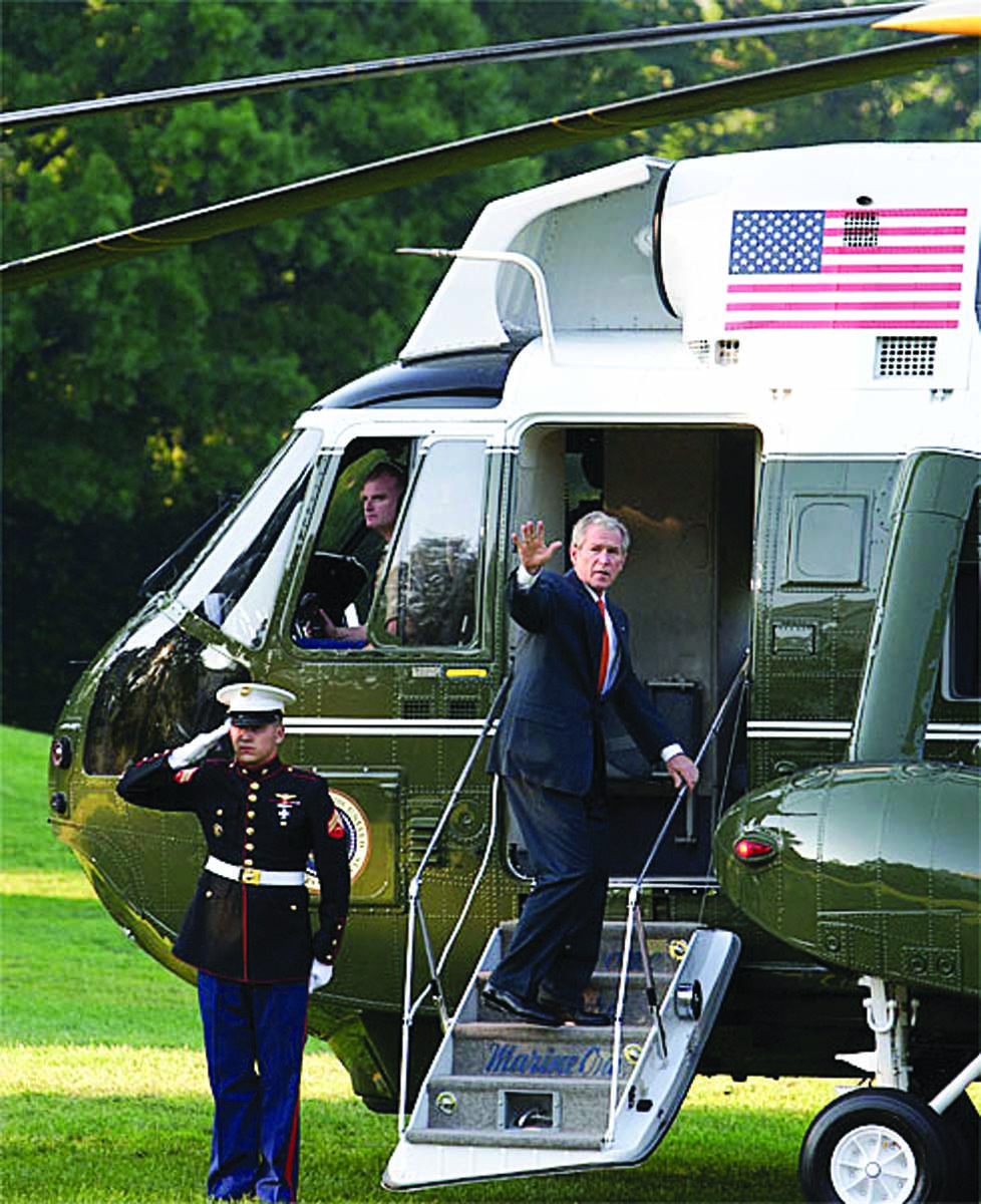Lt. Col. Kevin G. Hunter '99 is in the cockpit of Marine One as President George W. Bush climbs aboard.