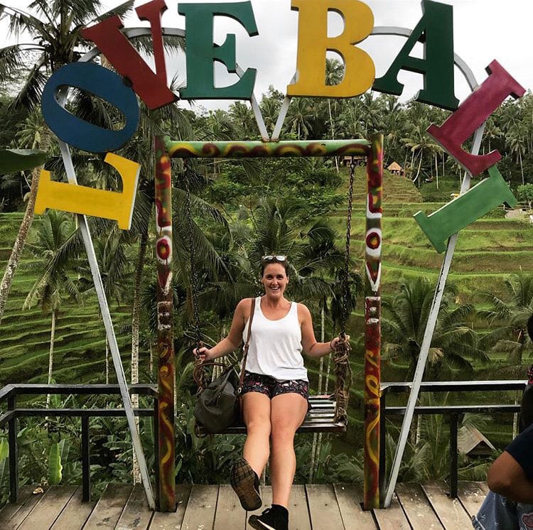 Susan Malone '13 at the swing and "Love Bali" sign at Tegalalang Rice Terraces in Ubud, Bali, Indonesia.