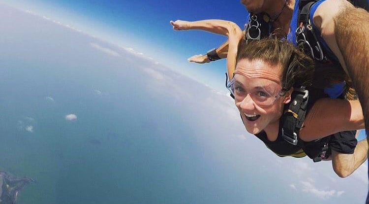 Susan Malone '13 skydiving over Mission Beach, Queensland, Australia, during her working vacation last year.