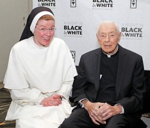 Sitting alongside Sister Ann Frances Klein, O.P., campus minister, Father Ertle attended the College’s A Night in Black & White fundraiser in Boston in 2016. 