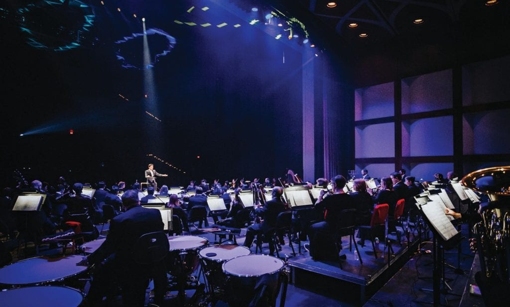 Conducting is art, according to Dr. Troy Quinn '05, shown conducting the Owensboro Symphony Orchestra in Kentucky. He also teaches conducting at the University of Southern California.