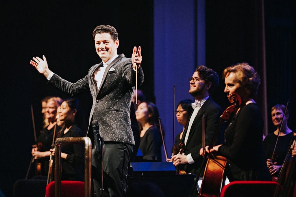 Dr. Troy Quinn '05 acknowledges applause after conducting the Owensboro Symphony Orchestra in Kentucky.
