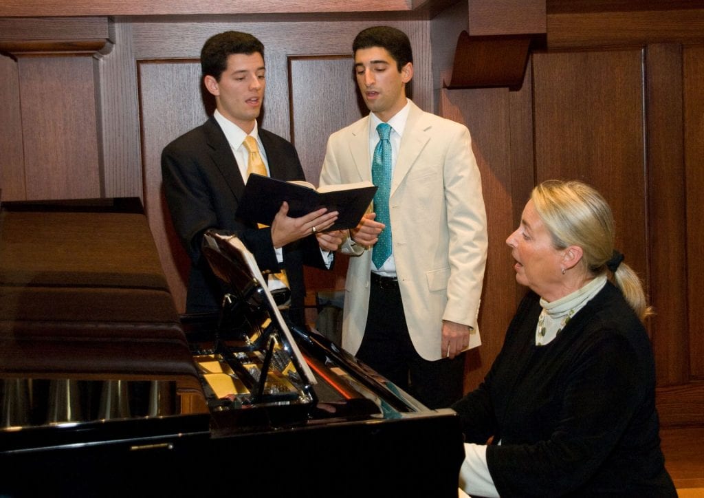 At a dinner to mark the 80th anniversary of Friars Club in 2008, Dr. Troy Quinn '05, left, sang with his brother, Shane Quinn '07, as Sherry Humes Dane, director of liturgical music, accompanied them on piano.