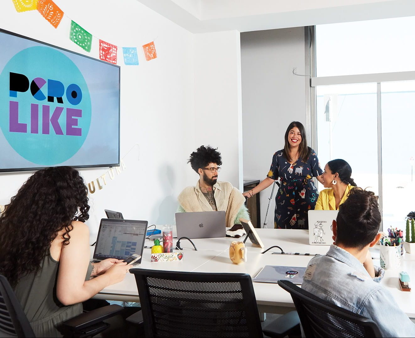 Alexis Tirado '02 with her team at BuzzFeed in Los Angeles. She is supervising producer for Pero Like, the Latino brand at the digital media company.