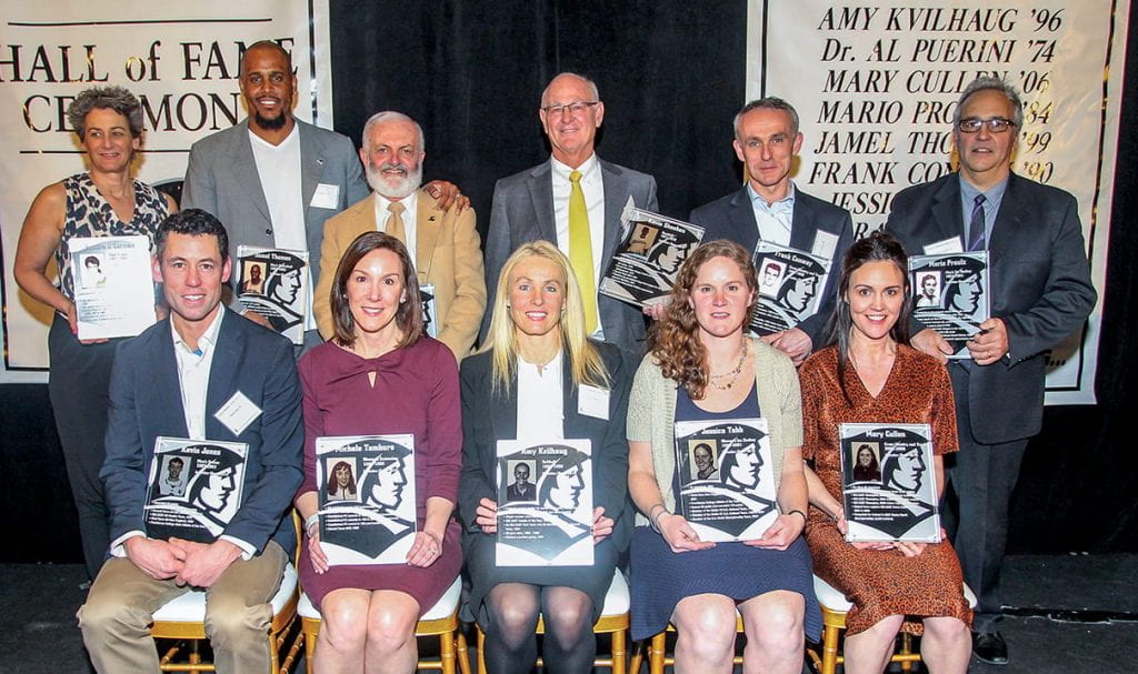 Inductees in the 2019 PC Athletics Hall of Fame class are, front row, from left: Kevin Jones ’00 & ’06G, Michele Tamburo ’95, Amy Kvilhaug ’96, Jessica Tabb ’01, and Mary Cullen ’06. Rear: Sandra O’Gorman ’89, Jamel Thomas ’99, Albert J. Puerini, M.D. ’74, Kevin Sheehan ’73 & ’78G, Frank Conway ’90, and Mario Proulx ’84.