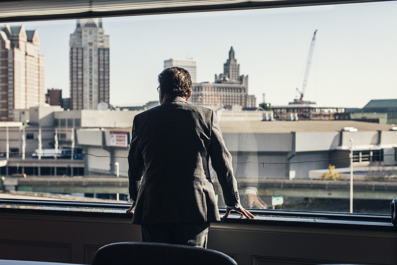 Judge Frank Caprio '58 & '08Hon. surveys downtown Providence from the window of his Federal Hill law office.