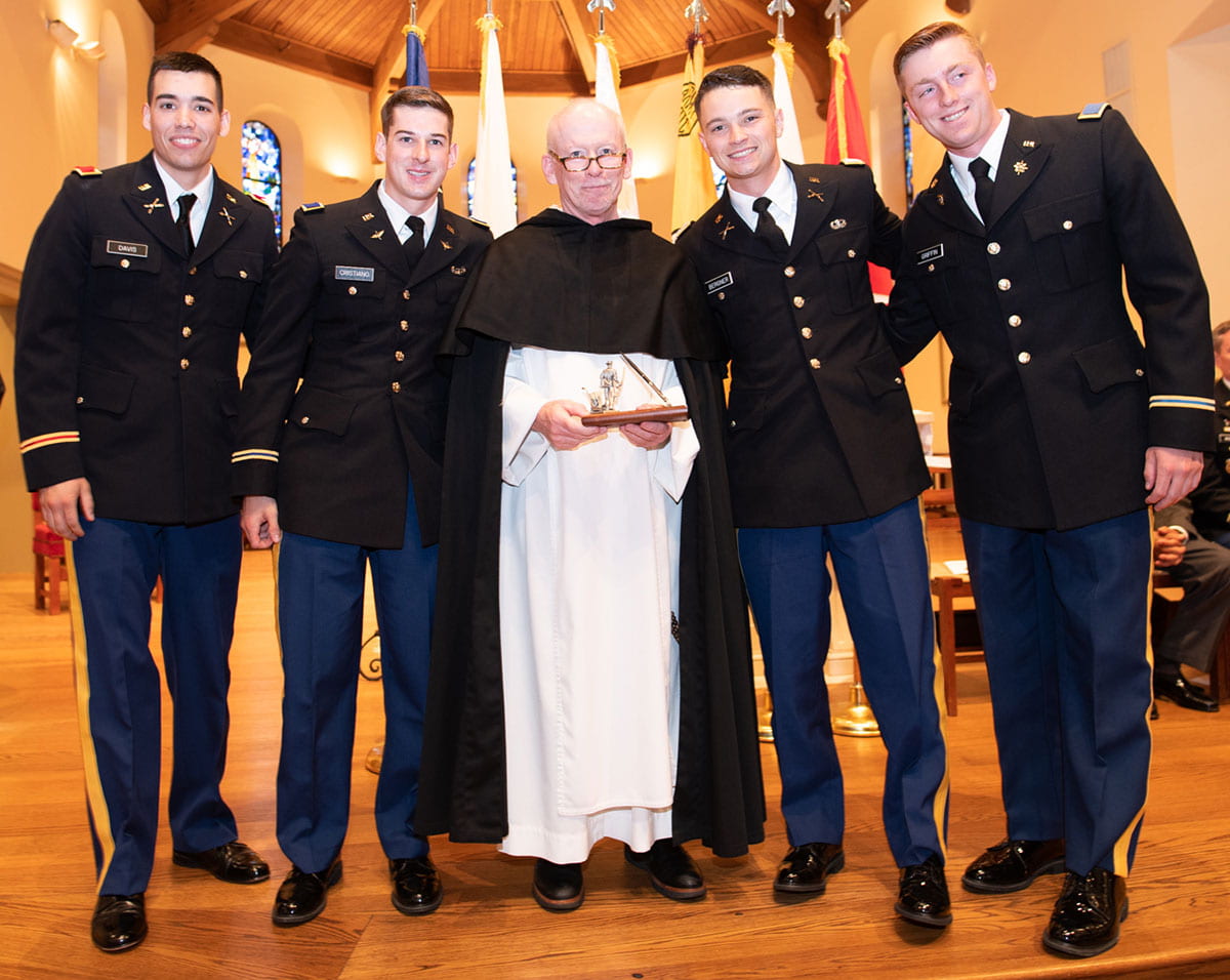 The newly commissioned second lieutenants with College President Rev. Brian J. Shanley, O.P. '80. From left are Marc Davis '19, Ryan Cristiano '19, Justin Bergner '19, and Kyle Griffin '19