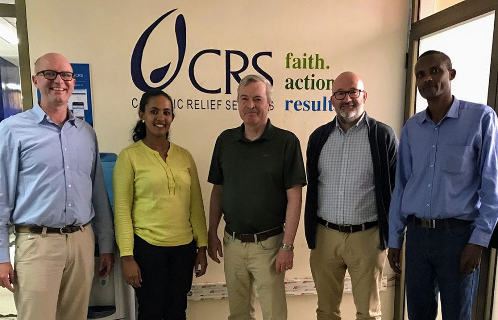 Dr. Terence McGoldrick, center, associate professor of theology at PC, at with the Catholic Relief Services team at the CRS headquarters in Addis Ababa, Ethiopia.