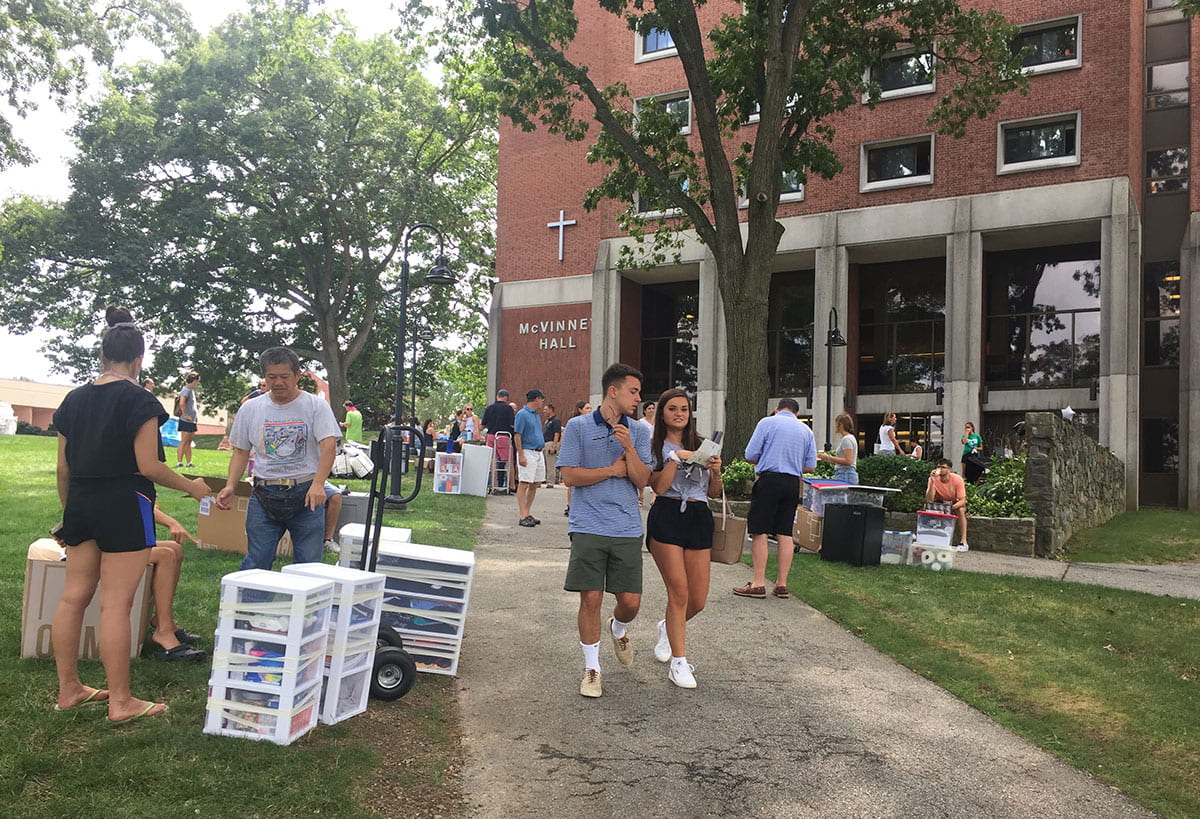 Move-In Day is busy outside McVinney Hall.