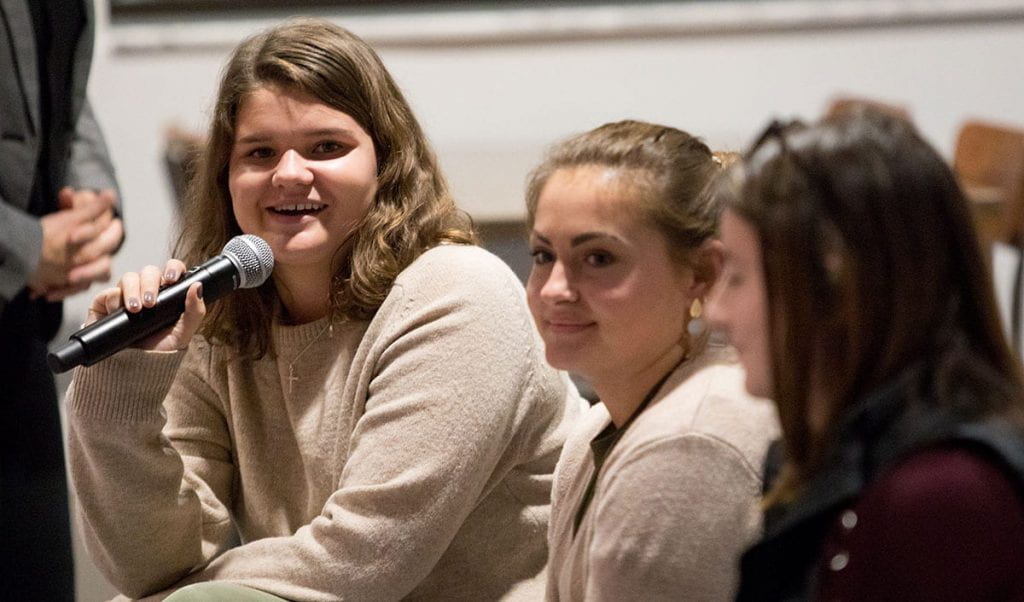 Kathleen Garvey ’20, far left, asks a question during the panel discussion.