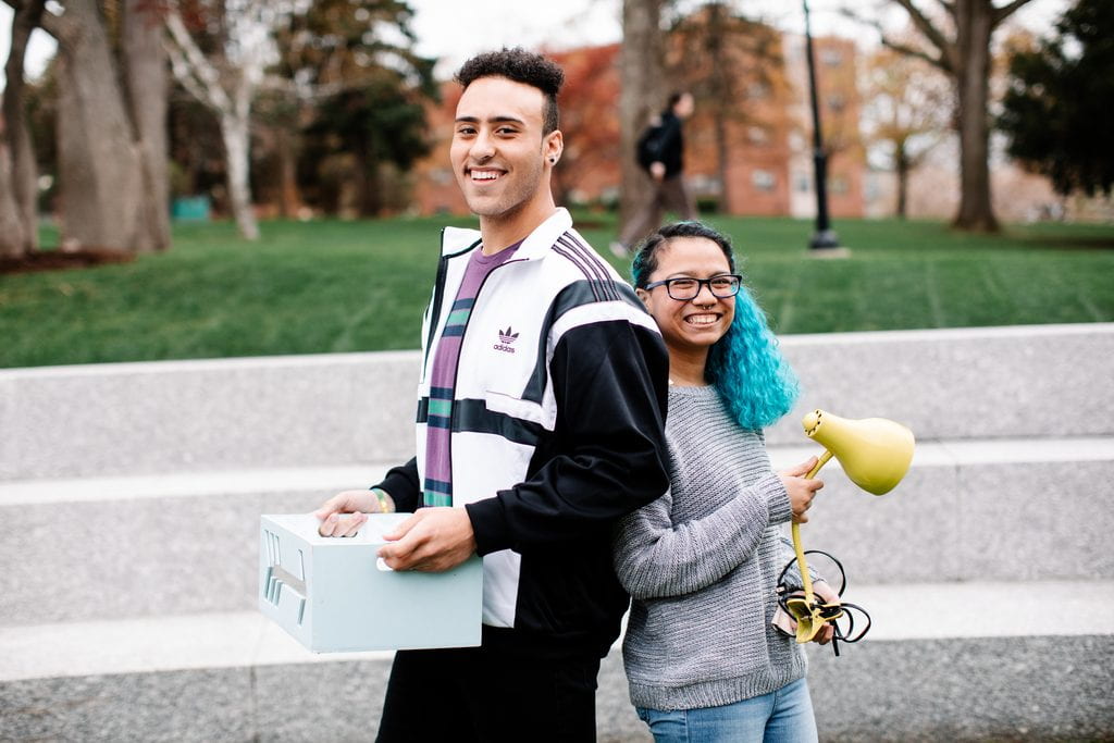 Jolssen Rodriguez ’21, left, and Lucia Gonzalez ’22, members of Lightening Others’ Loads, with items collected from students leaving campus for the summer