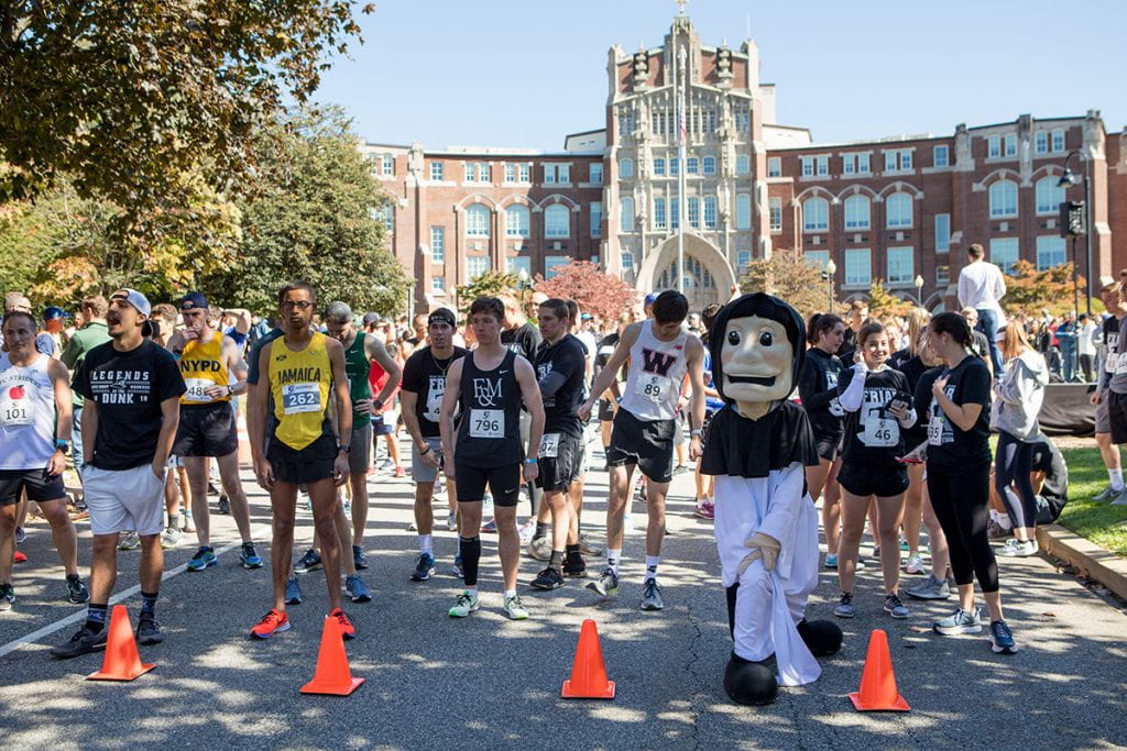 Runners at the starting line in front of Harkins Hall prepare for the 10th annual Friar 5K.