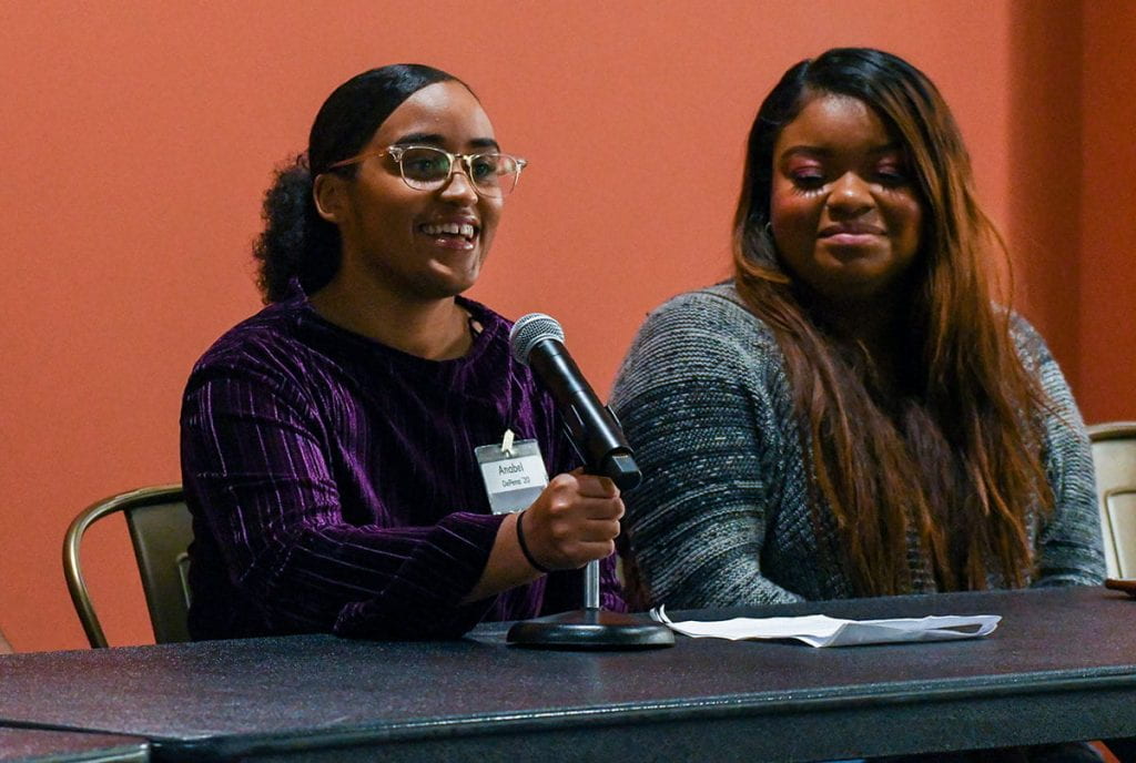 Anabel DePena '20, left, offers her thoughts during the panel presentation on "How We Do Intersectionality." At right is another panelist, Karisneyca Gutierrez '18 & '20G.