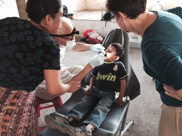 A Guatemalan boy is examined at a dental clinic.