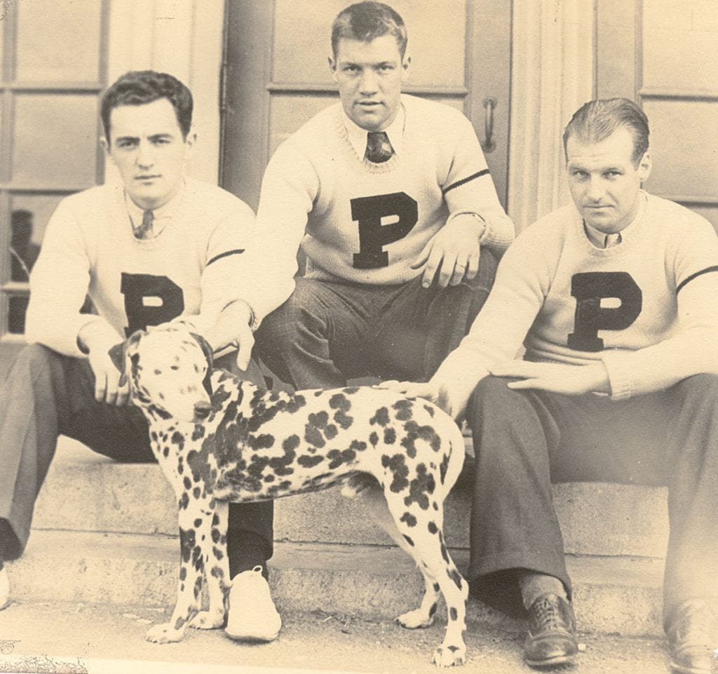 Friar Boy, the dalmation, with football players. 1935