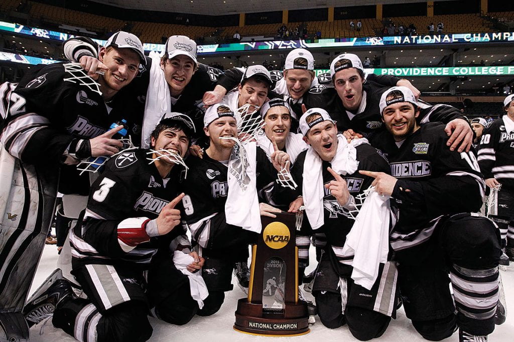 Exuberant Friars from the Class of 2016 surround the coveted championship trophy after the 4-3 win over BU. Front row, from left, John Gilmour '16, Trevor Mingoia '16, Brandon Taney '16, and Nick Saracino '16. Back row, from left, Jon Gillies '16, Kevin Rooney '16, Tom Parisi '16, Brooks Behling '16, and Steve McParland '16.