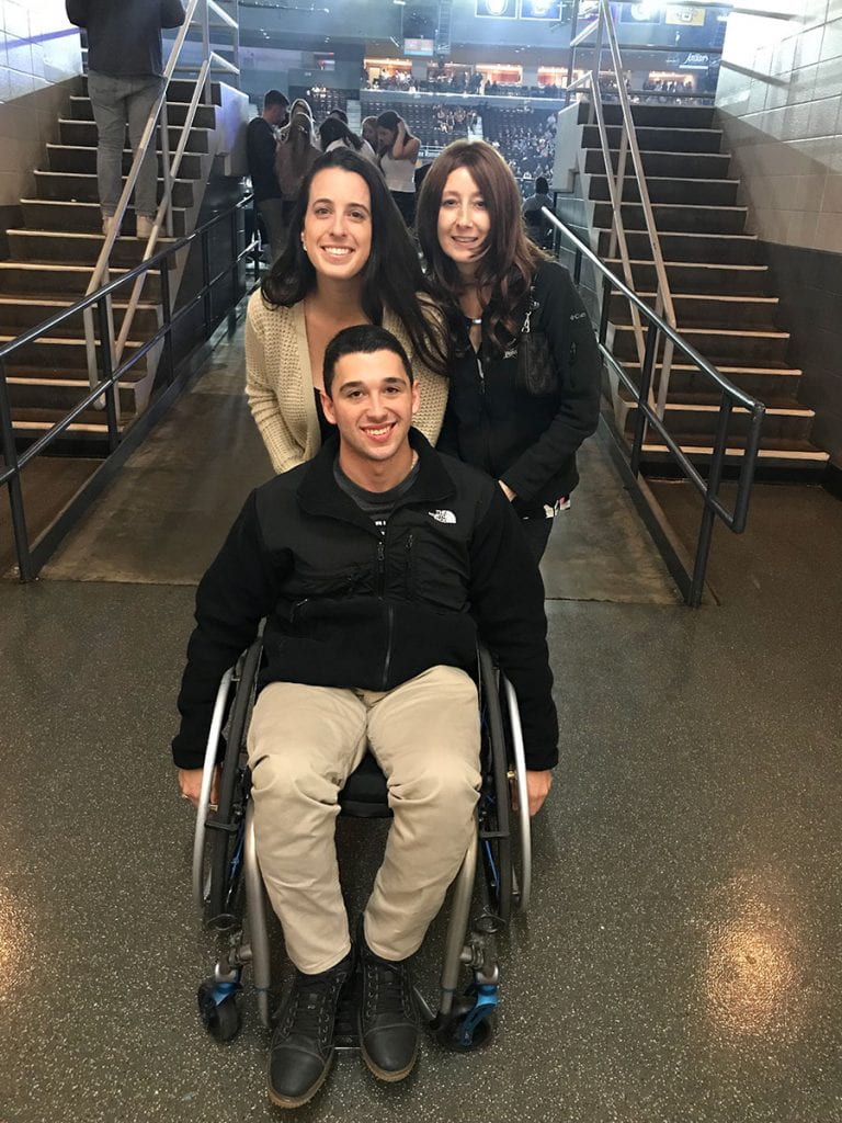 At Late Night Madness at the Dunkin' Donuts Center in October, Jennifer Rivera '06 & '13G, right, reunited with Francisco Oller '16 and Nicole Rozzero '16G, her former graduate assistant.