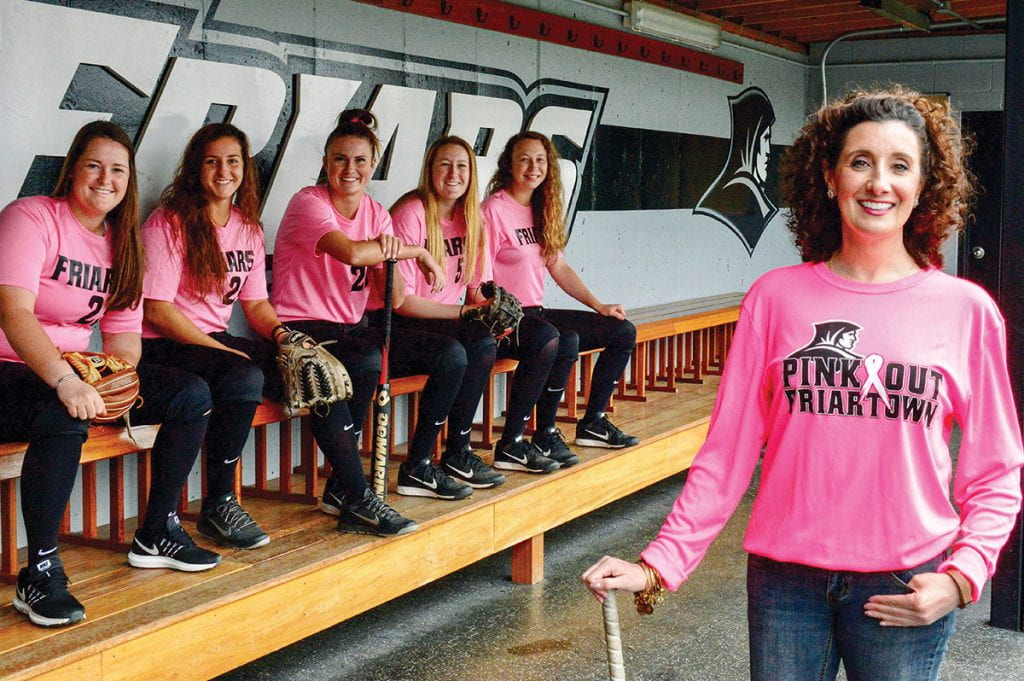 Jennifer A. Rivera ’06 & ’13G is joined by members of the Friars’ softball team in this photo for the 2018-2019 Gloria Gemma Breast Cancer Resource Foundation calendar. With her are, from left, Brittney Veler ’18, Taylor Stephen ’19, Christina Ramirez ’18, Julianne Rurka ’18, and Emma Lee ’19. (Photo: Lisa Bruno, 64 Degrees Photography)