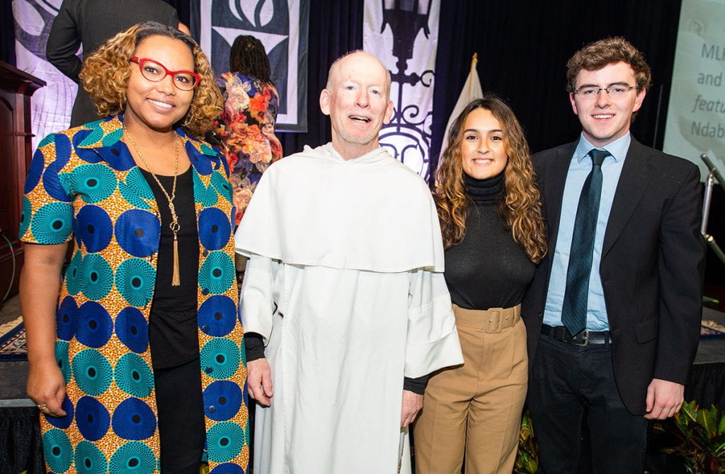 College President Rev. Brian J. Shanley, O.P. '80, with recipient of the MLK Vision Award. From left are Dr. Terza LIma-Neves '00; Laura Arango '20, representation the Organization of Latin American Students, and John "Jack" Murphy '20.
